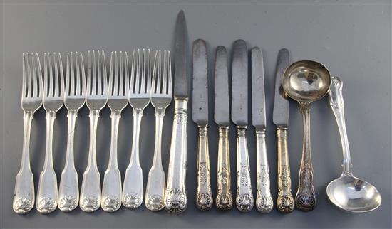 A set of seven George III silver fiddle, thread and shell pattern silver table forks, engraved with the Houghton crest